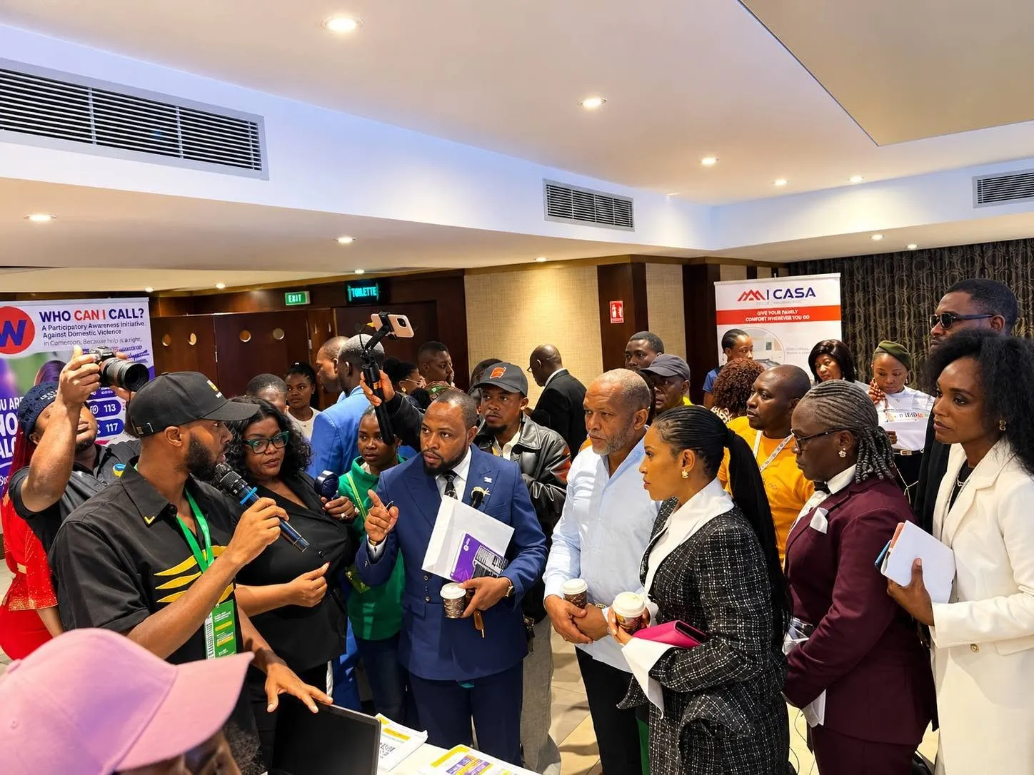 A crowd gathered around the Tribe exhibition stand during a demonstration.