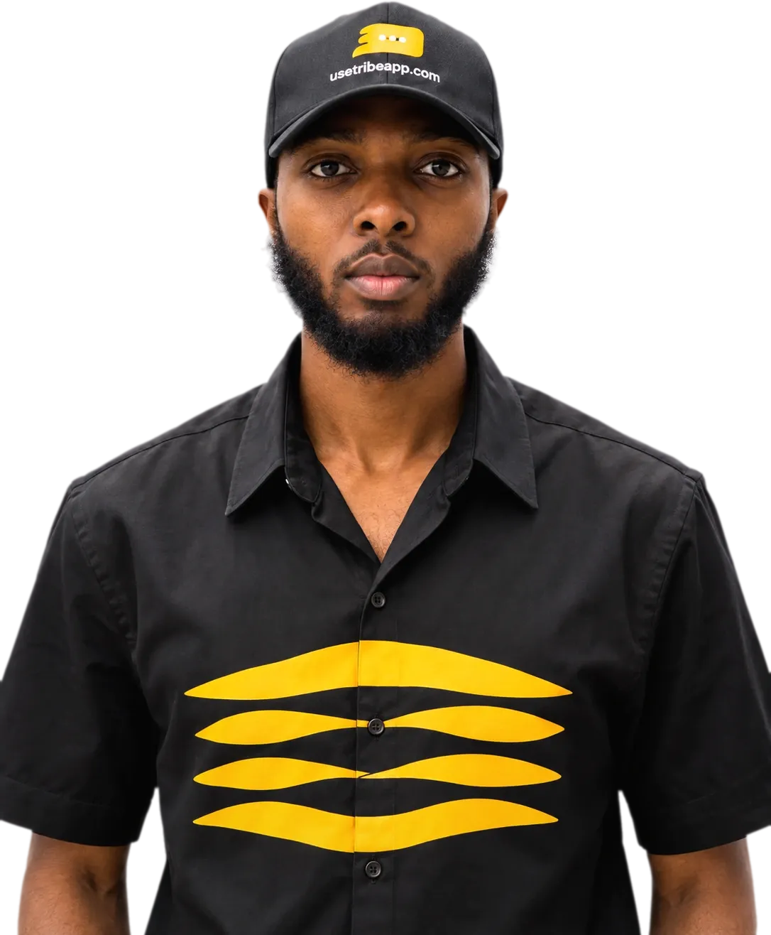 Portrait of Emmanuel Cobbi wearing a black Tribe cap and a black shirt with the yellow Tribe mark.